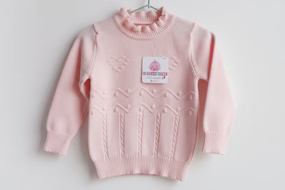 Sweater tejido verde menta con textura en relieve y cuello con volado para niña